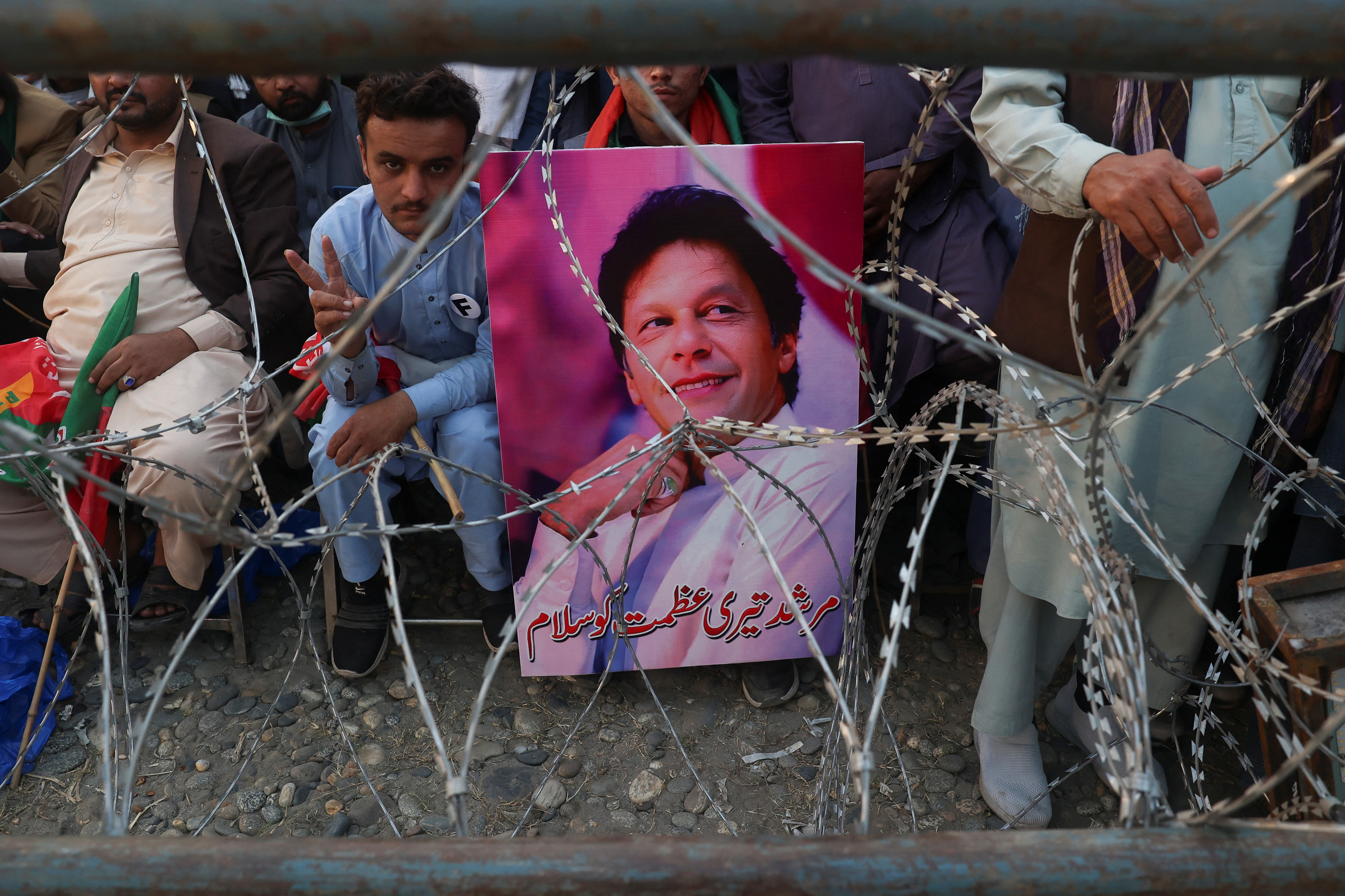 Supporters of jailed former Pakistani Prime Minister Imran Khan attend a rally in Swabi