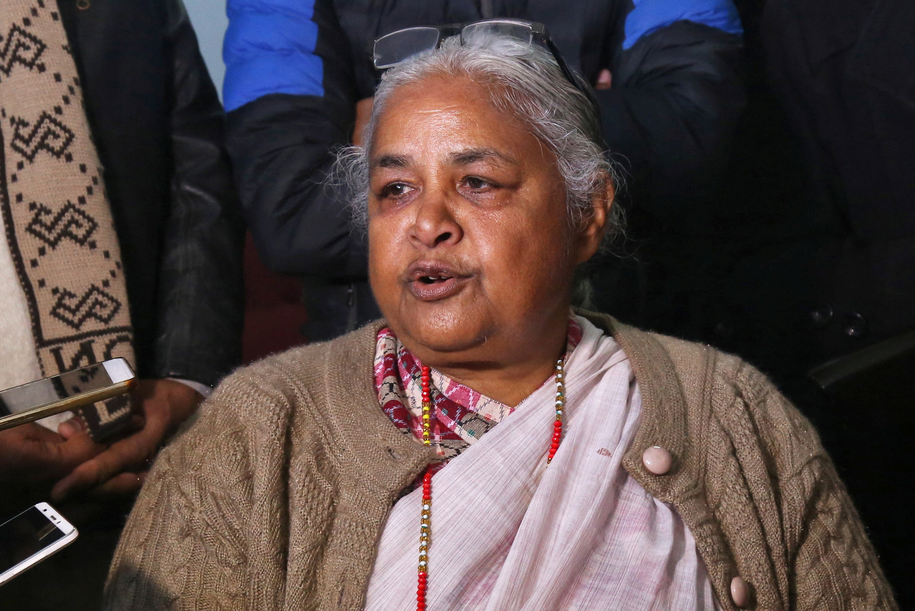 Nepal's former Chief Justice Sushila Karki speaks with the media after meeting Doctor Govinda KC, in Kathmandu