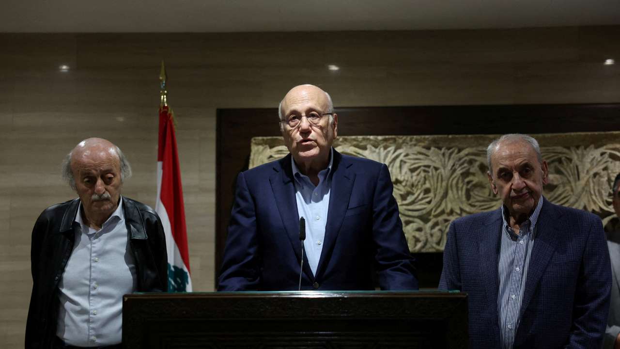 Lebanon's caretaker Prime Minister Najib Mikati stands next to Lebanese Parliament Speaker Nabih Berri, and Lebanese Druze leader Walid Jumblatt, as he speaks during a press conference in Beirut