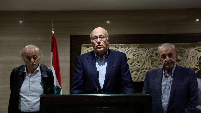 Lebanon's caretaker Prime Minister Najib Mikati stands next to Lebanese Parliament Speaker Nabih Berri, and Lebanese Druze leader Walid Jumblatt, as he speaks during a press conference in Beirut