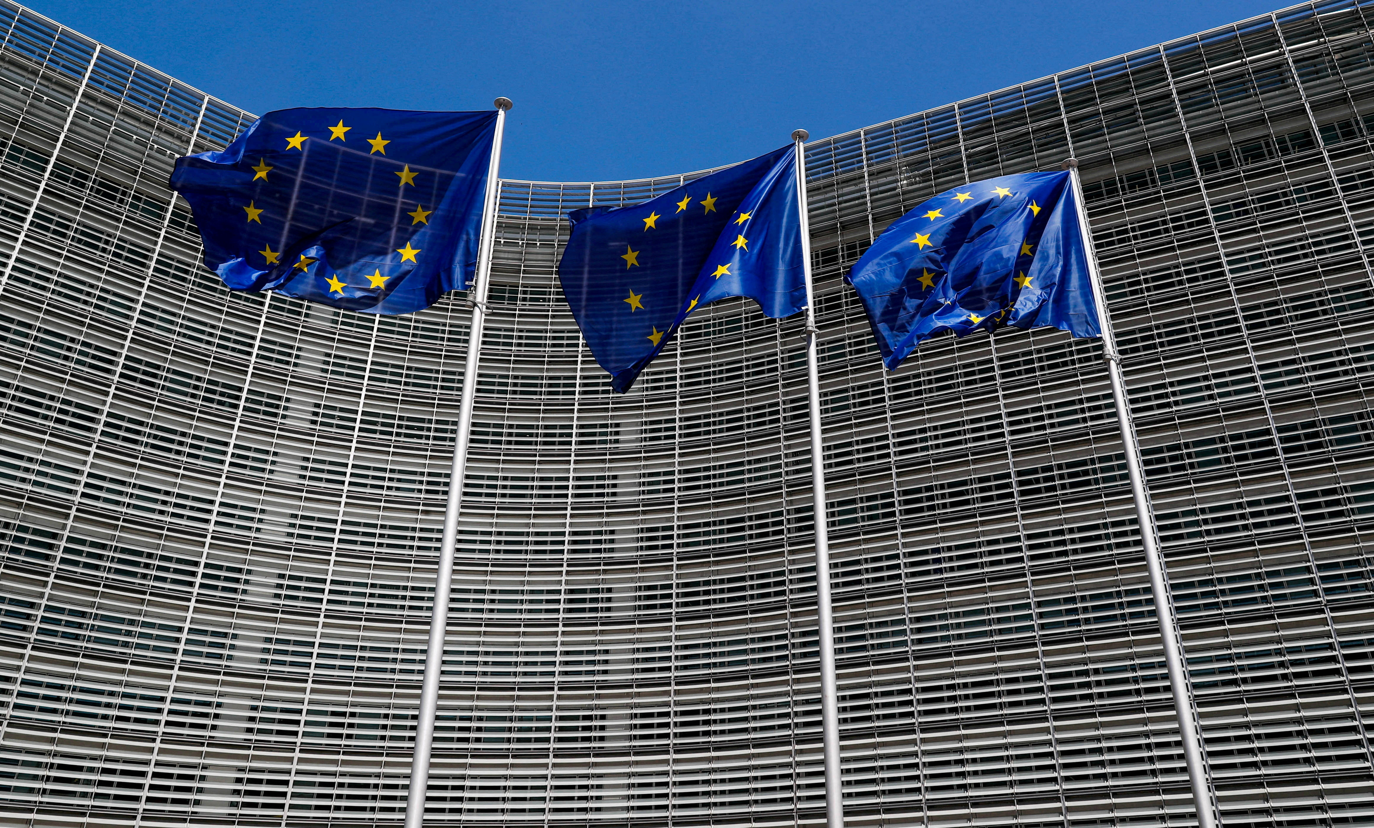 FILE PHOTO: European Union flags flutter outside the EU Commission headquarters in Brussels