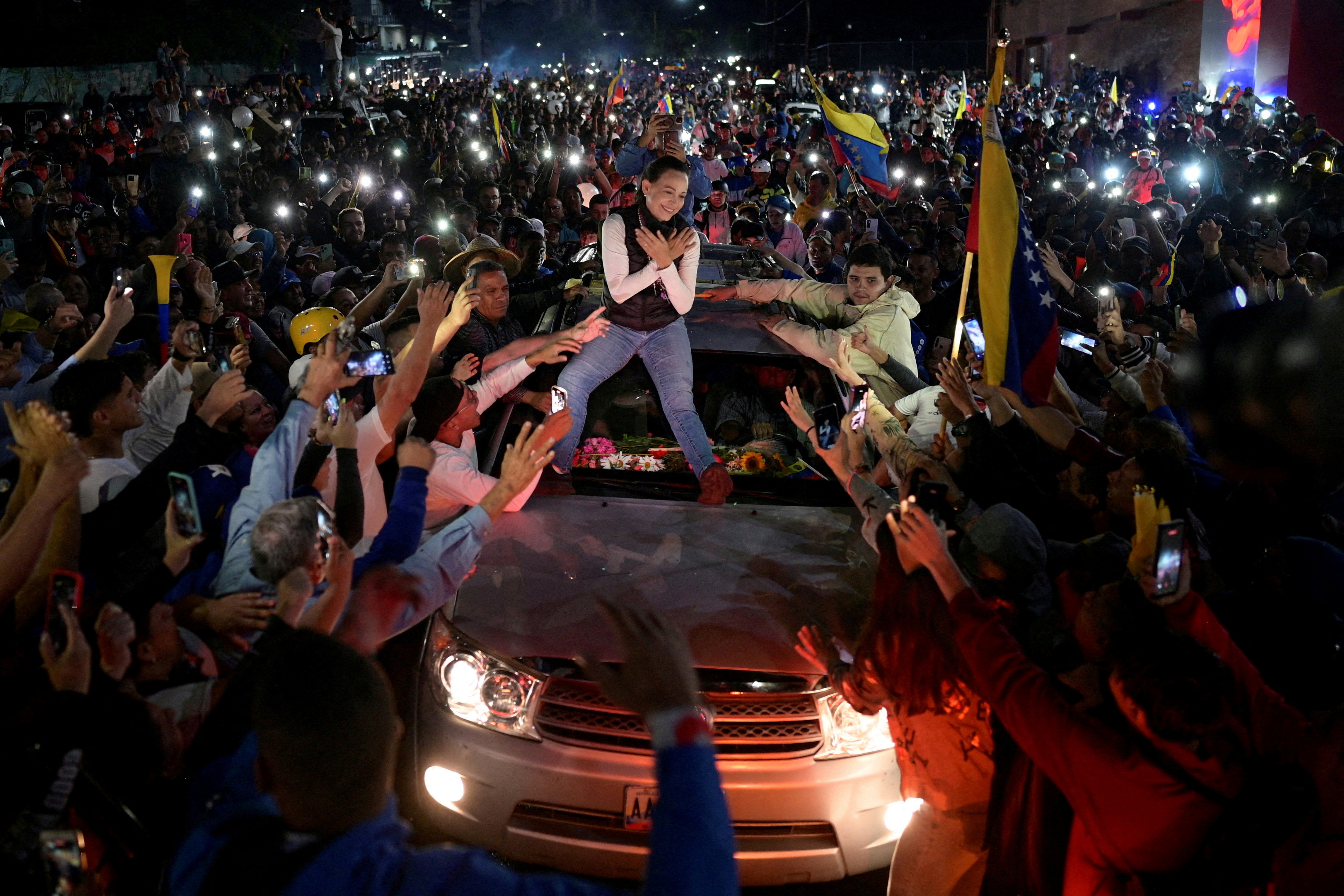 FILE PHOTO: FILE PHOTO: Venezuelan opposition leader Maria Corina Machado greets supporters
