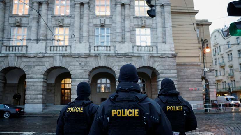 Members of the Police stand guard following a shooting at one of Charles University's buildings in Prague