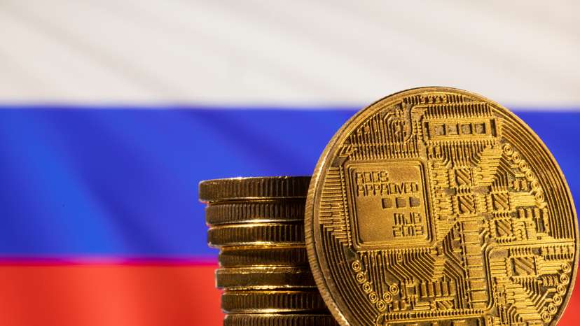 Illustration shows a representation of the cryptocurrency and Russian flag