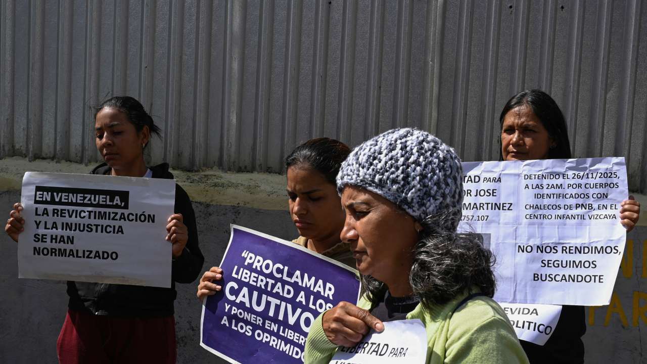 Family members of detainees wait outside the National Police Zone 7 Detention Centre, in Caracas