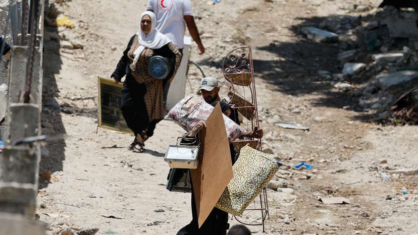 Palestinians remove belongings from their homes threatened with demolition, in Tulkarm camp