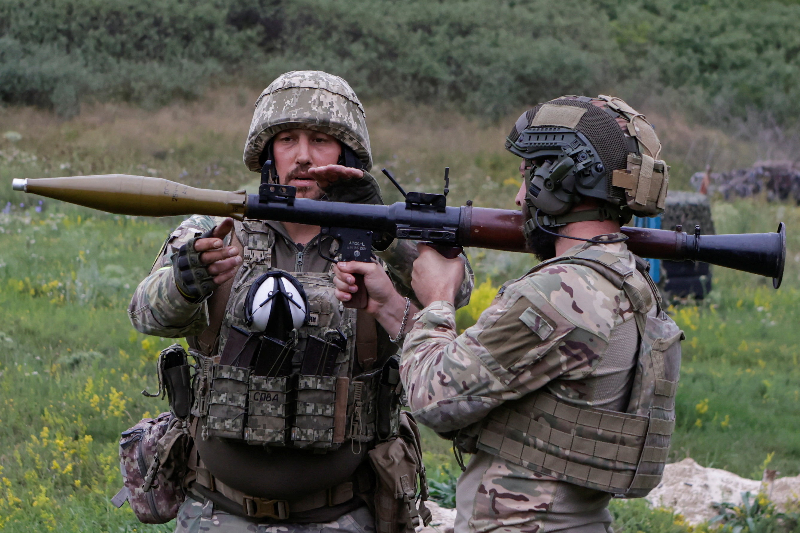 Ukrainian servicemen attend military drills at a training ground in Kharkiv region