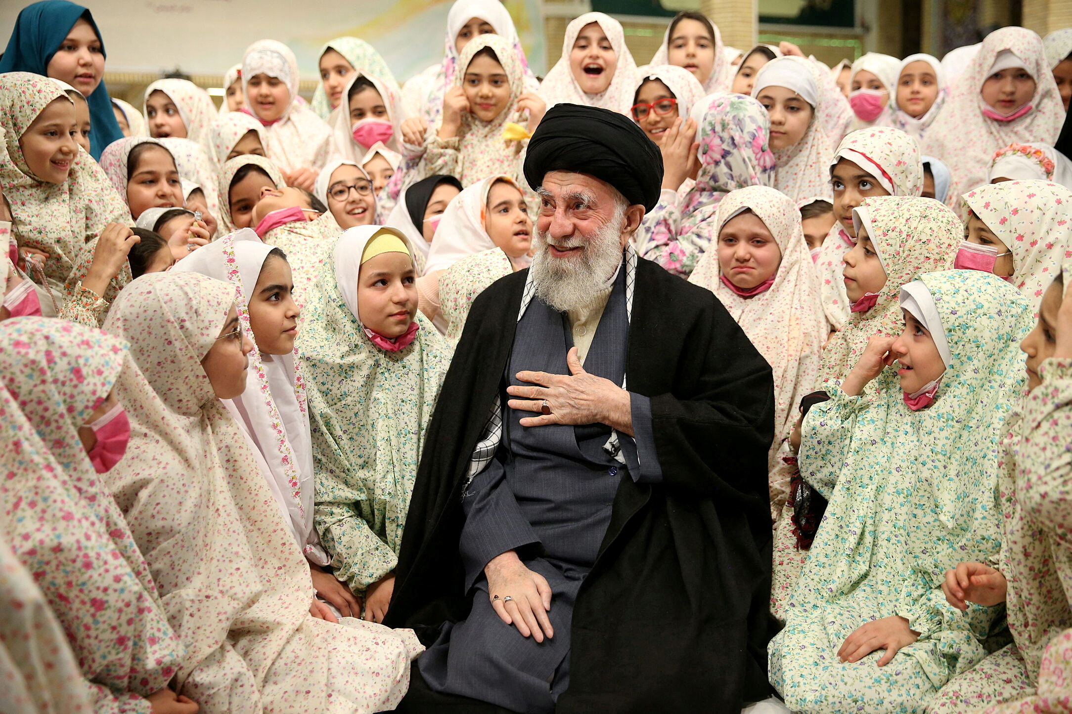 FILE PHOTO: Iran's Supreme Leader Ayatollah Ali Khamenei prays during a meeting with a group of girls in Tehran