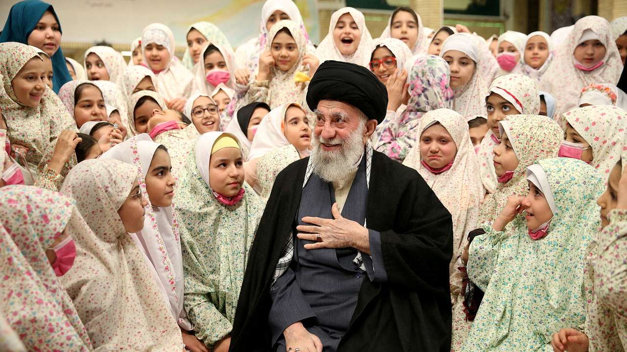 FILE PHOTO: Iran's Supreme Leader Ayatollah Ali Khamenei prays during a meeting with a group of girls in Tehran