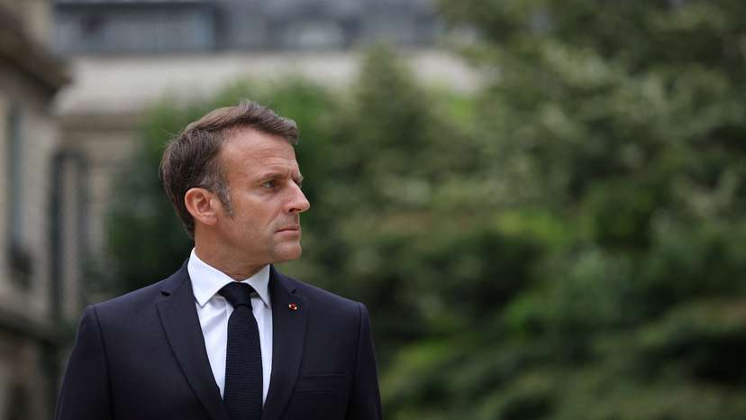 French President Emmanuel Macron reviews troops that will take part in the Bastille Day parade, in Paris