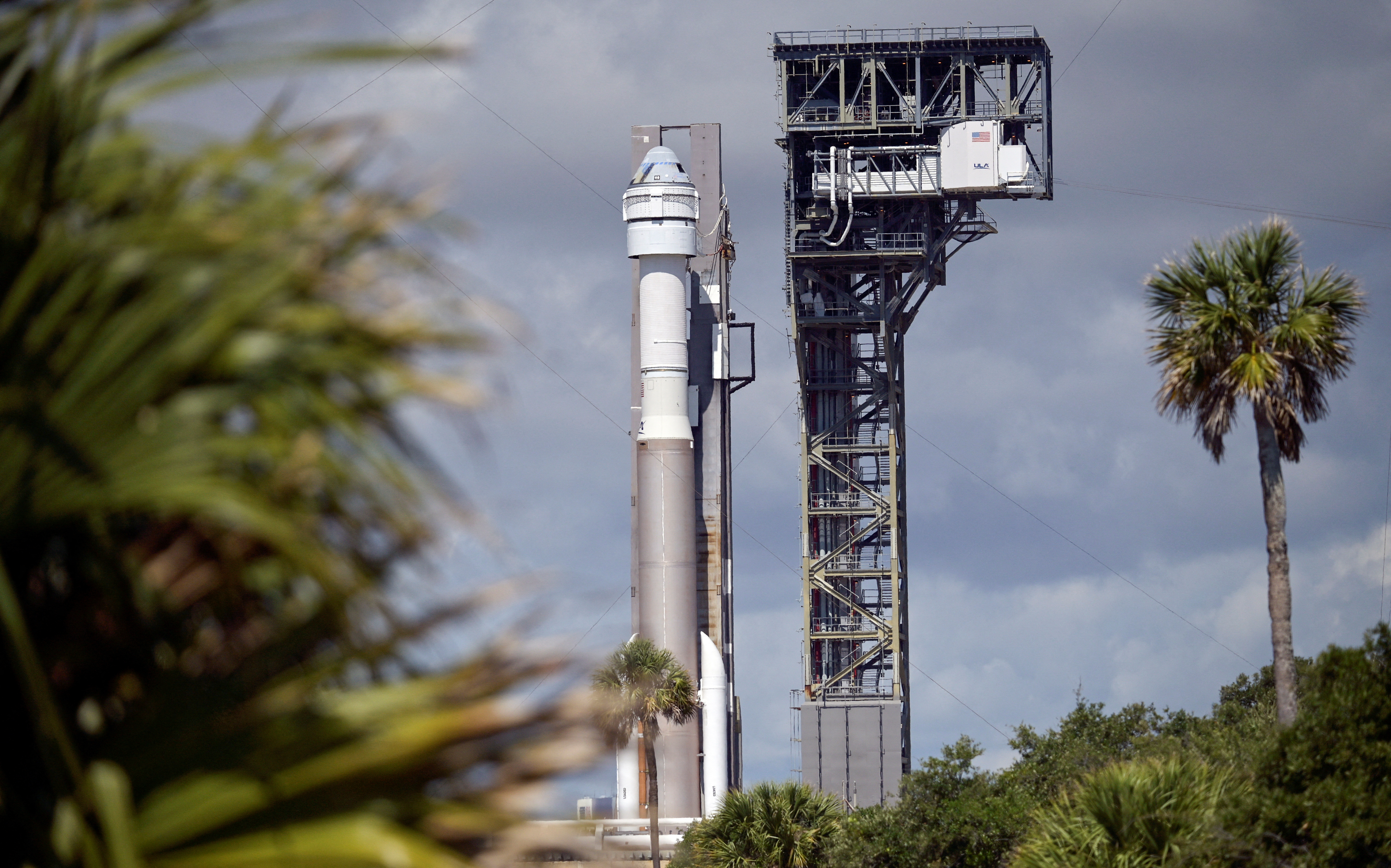Boeing's Starliner spacecraft aboard a United Launch Alliance Atlas V rocket rolls toward the launch pad, in Cape Canaveral