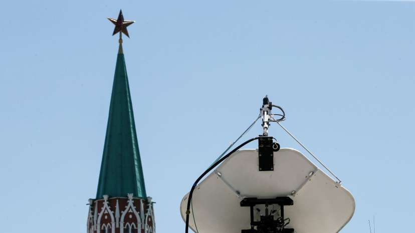 Vehicles of Russian state-controlled broadcaster Russia Today are seen near the Red Square in central Moscow