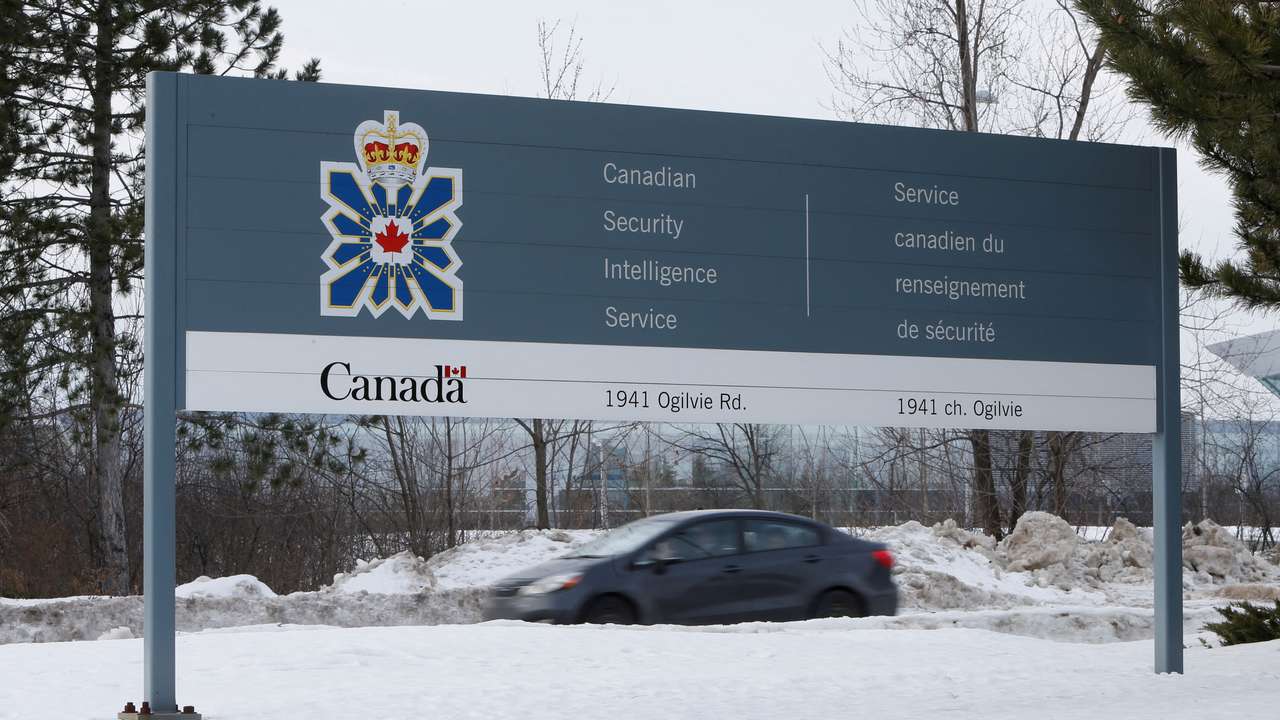 FILE PHOTO: A vehicle passes a sign outside the CSIS headquarters in Ottawa