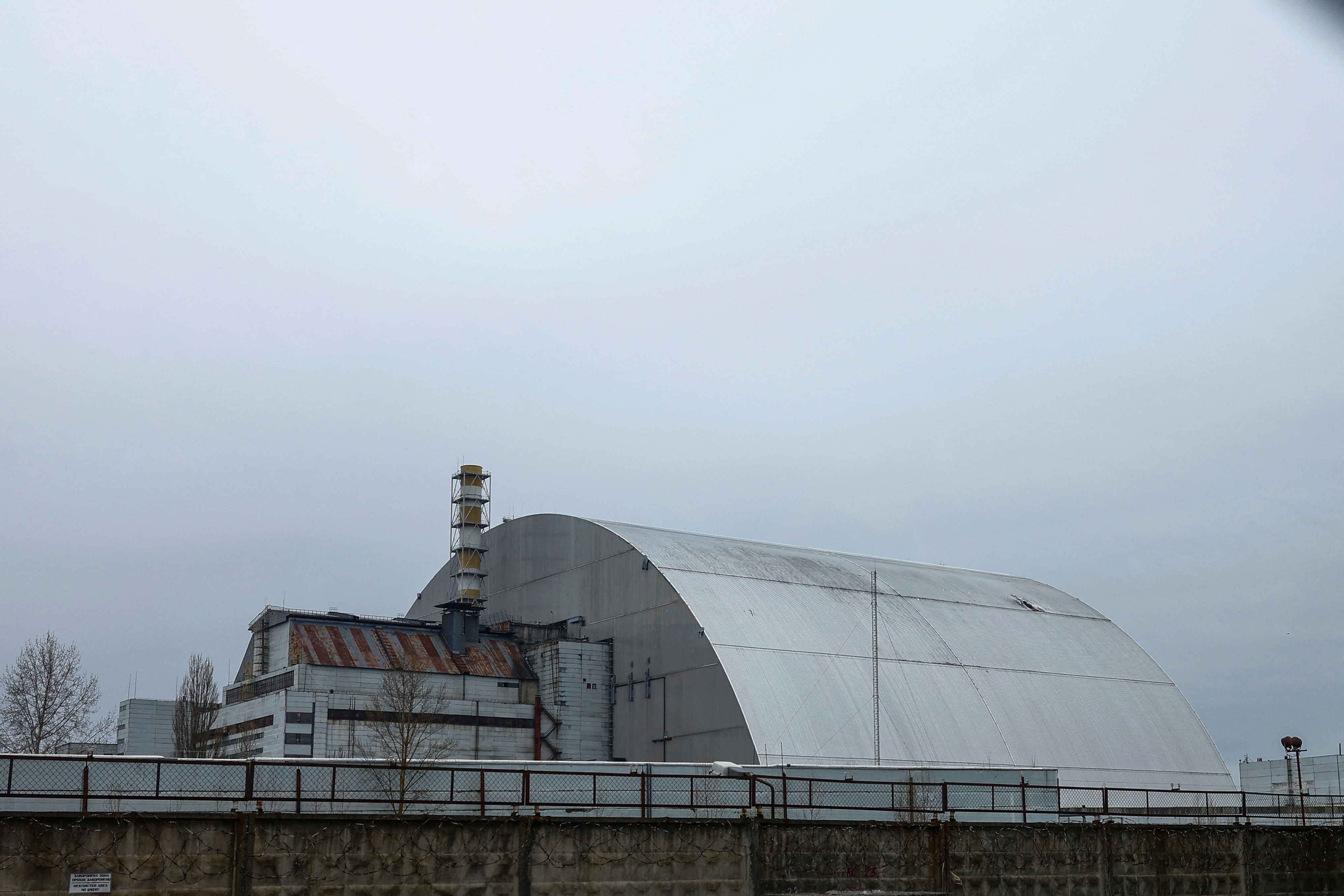 General view of the New Safe Confinement structure over the old sarcophagus covering the damaged fourth reactor at the Chornobyl Nuclear Power Plant