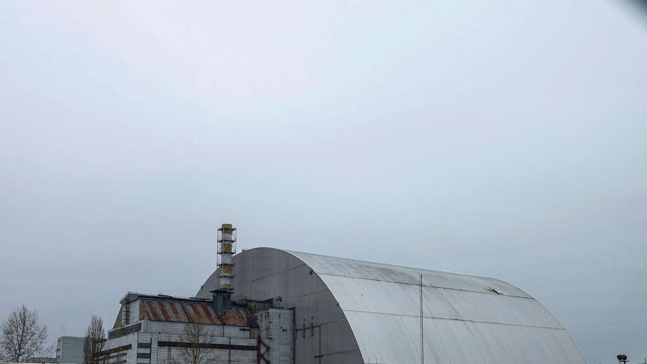 General view of the New Safe Confinement structure over the old sarcophagus covering the damaged fourth reactor at the Chornobyl Nuclear Power Plant