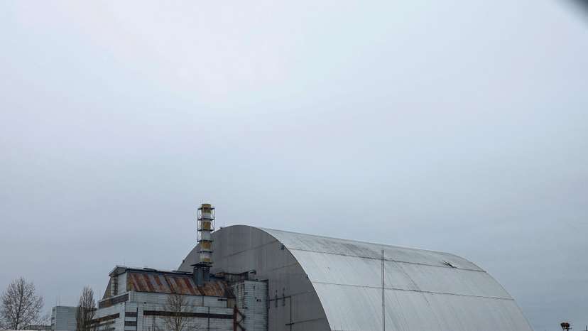 General view of the New Safe Confinement structure over the old sarcophagus covering the damaged fourth reactor at the Chornobyl Nuclear Power Plant