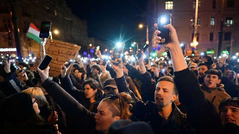 People protest after parliament fast-tracked legislation to ban the annual Pride march by LGBTQ+ communities, in Budapest