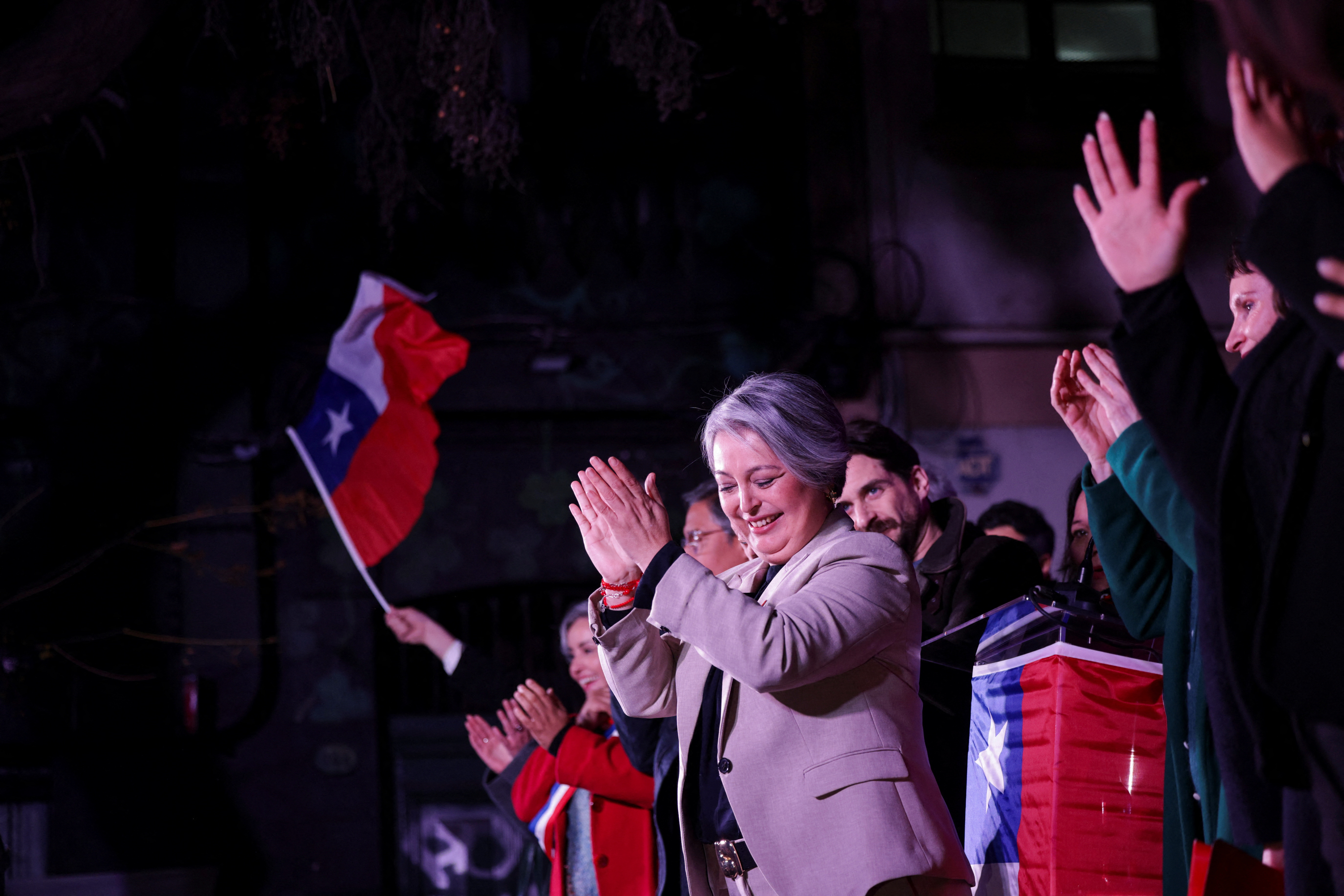 Former Labor Minister and member of Chile's communist party, Jeannette Jara, reacts after winning the presidential primaries in Santiago