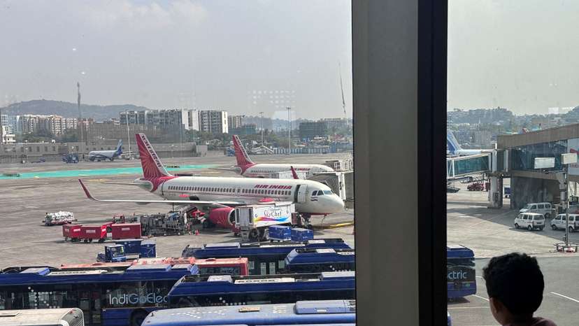 FILE PHOTO: A boy looks at Air India airline passenger aircrafts parked at the Chhatrapati Shivaji Maharaj International Airport in Mumbai