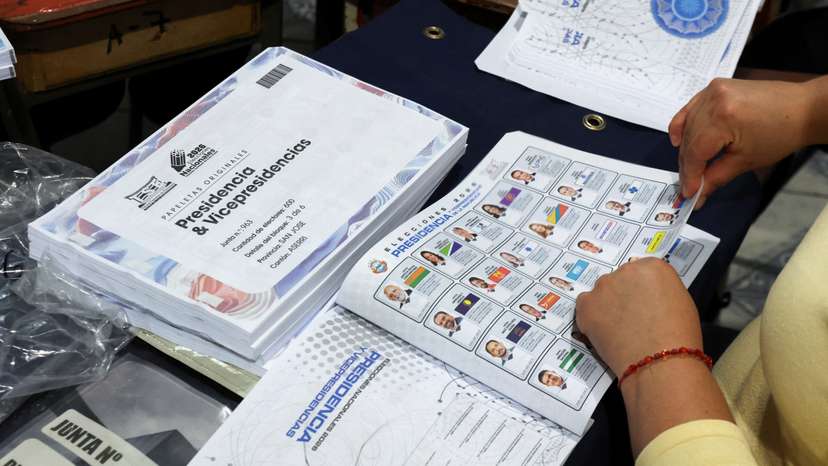 Costa Rican officials hand out voting materials ahead of February 1 general election, in San Jose