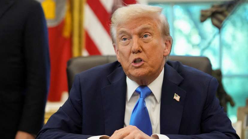 U.S. President Donald Trump signs executive orders in the Oval Office at the White House in Washington