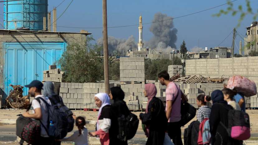 FILE PHOTO: Palestinian civilians evacuating from the north of the Gaza Strip walks towards south
