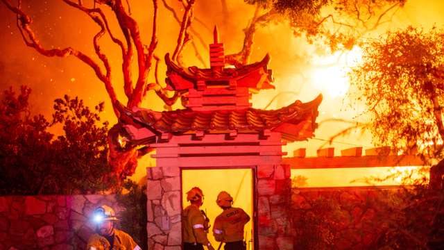 Palisades fire burns during a windstorm on the west side of Los Angeles