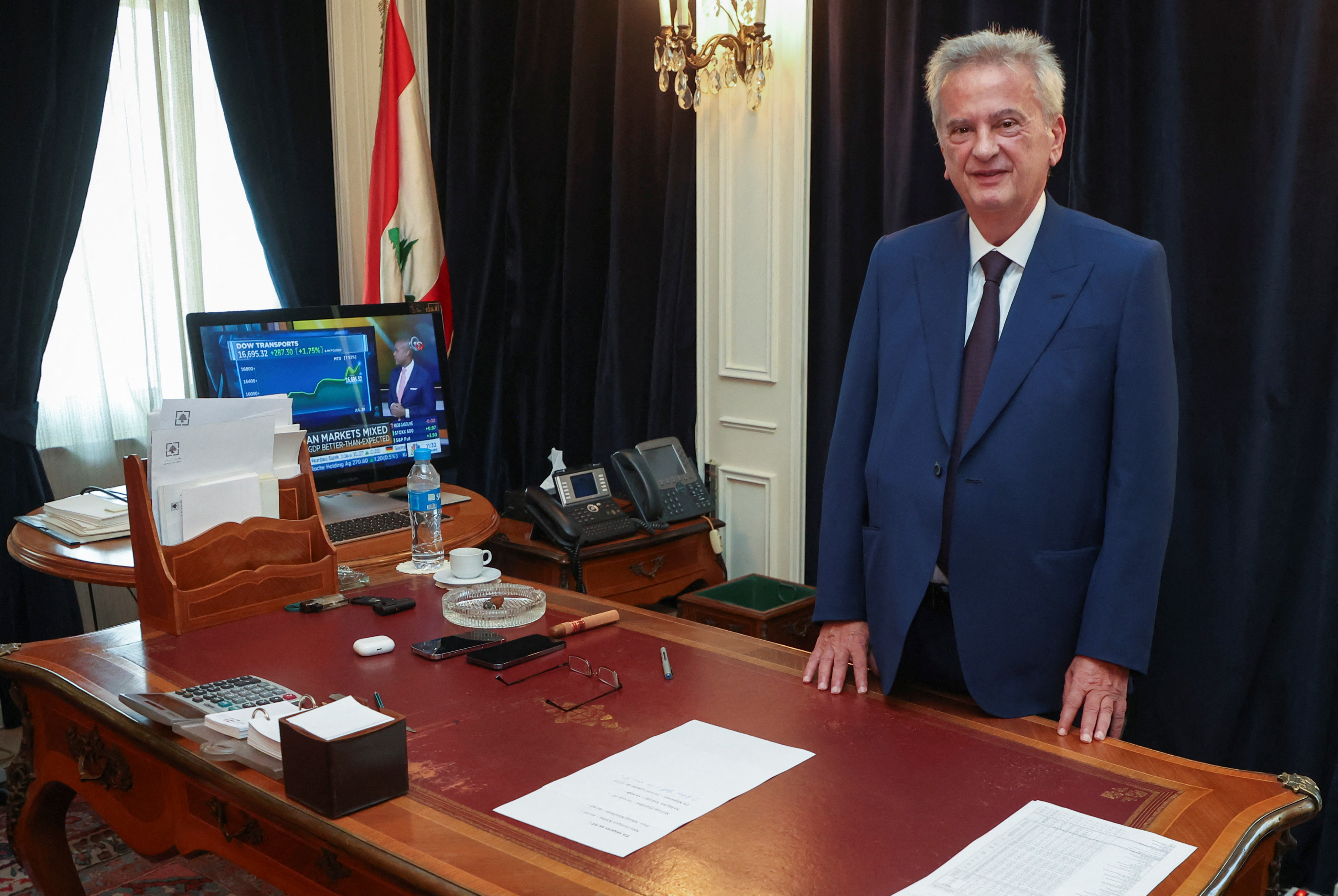 Longtime chief of Lebanon's Central Bank Riad Salameh, poses as he leaves office after a 30-year tenure, at Lebanon's Central Bank building in Beirut