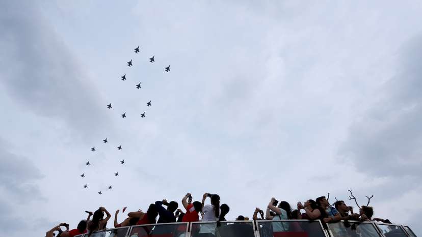F-16 planes from the Singapore Air Force fly over Marina Bay Sands during Singapore's Golden Jubilee, in Singapore