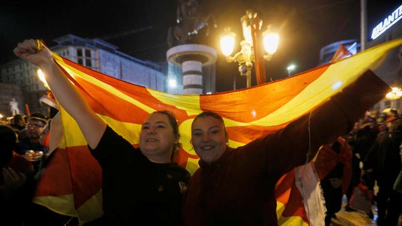 Supporters of VMRO-DPMNE party celebrate following the parliamentary and presidential elections in Skopje