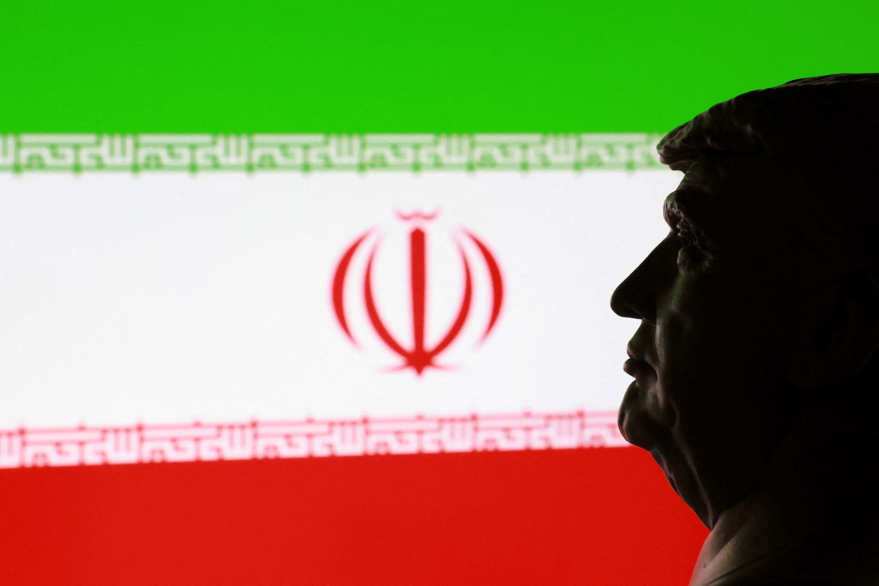 Illustration shows 3D printed miniature of U.S. president Donald Trump and Iranian flag