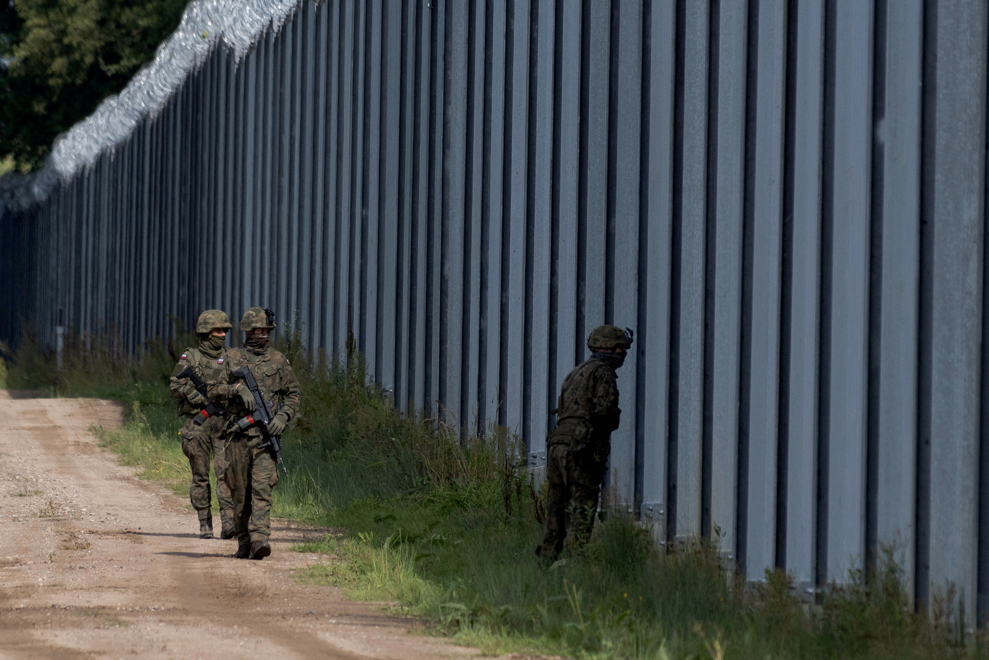 Polish soldiers patrol the Polish-Belarusian border