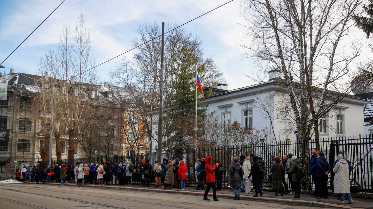 FILE PHOTO: Russians stand in a queue to vote, outside the Russian embassy in Oslo