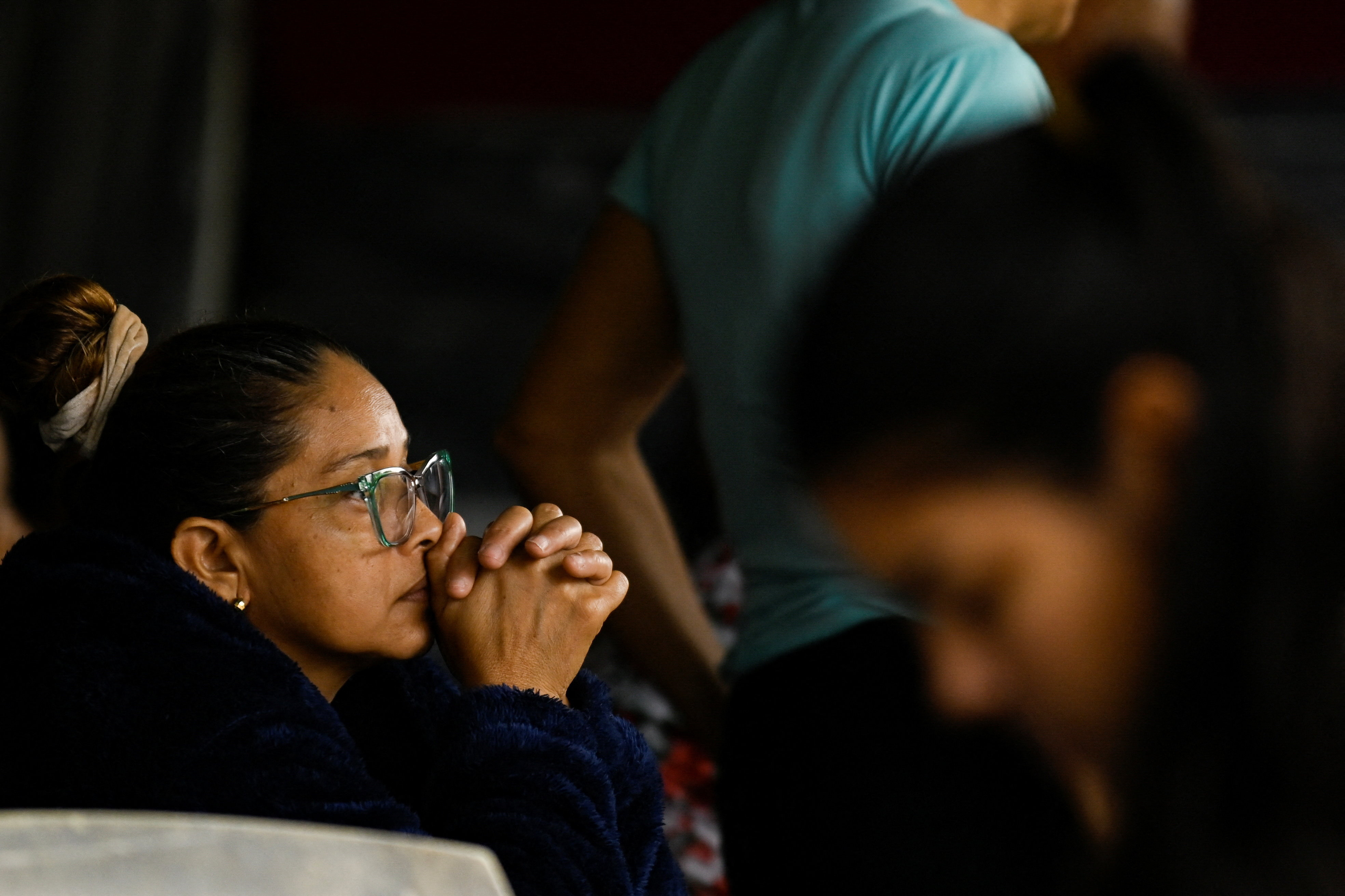 Family members of detainees wait outside the El Rodeo jail, in El Rodeo