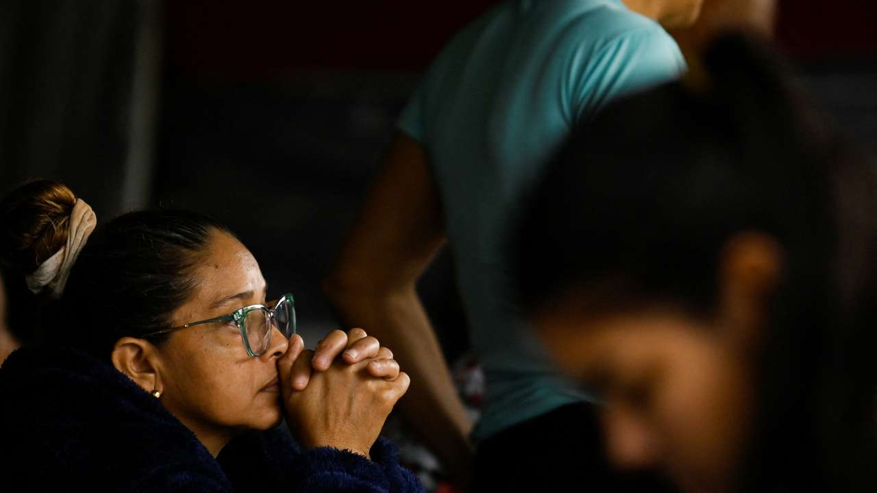 Family members of detainees wait outside the El Rodeo jail, in El Rodeo