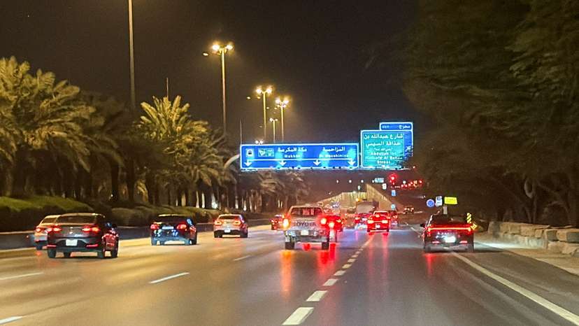Vehicles drive along a street near the Diplomatic Quarter in Riyadh