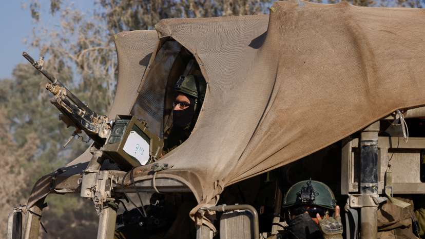 Israeli military vehicle manoeuvres, amid the Israel-Hamas conflict, near the Israel-Gaza border