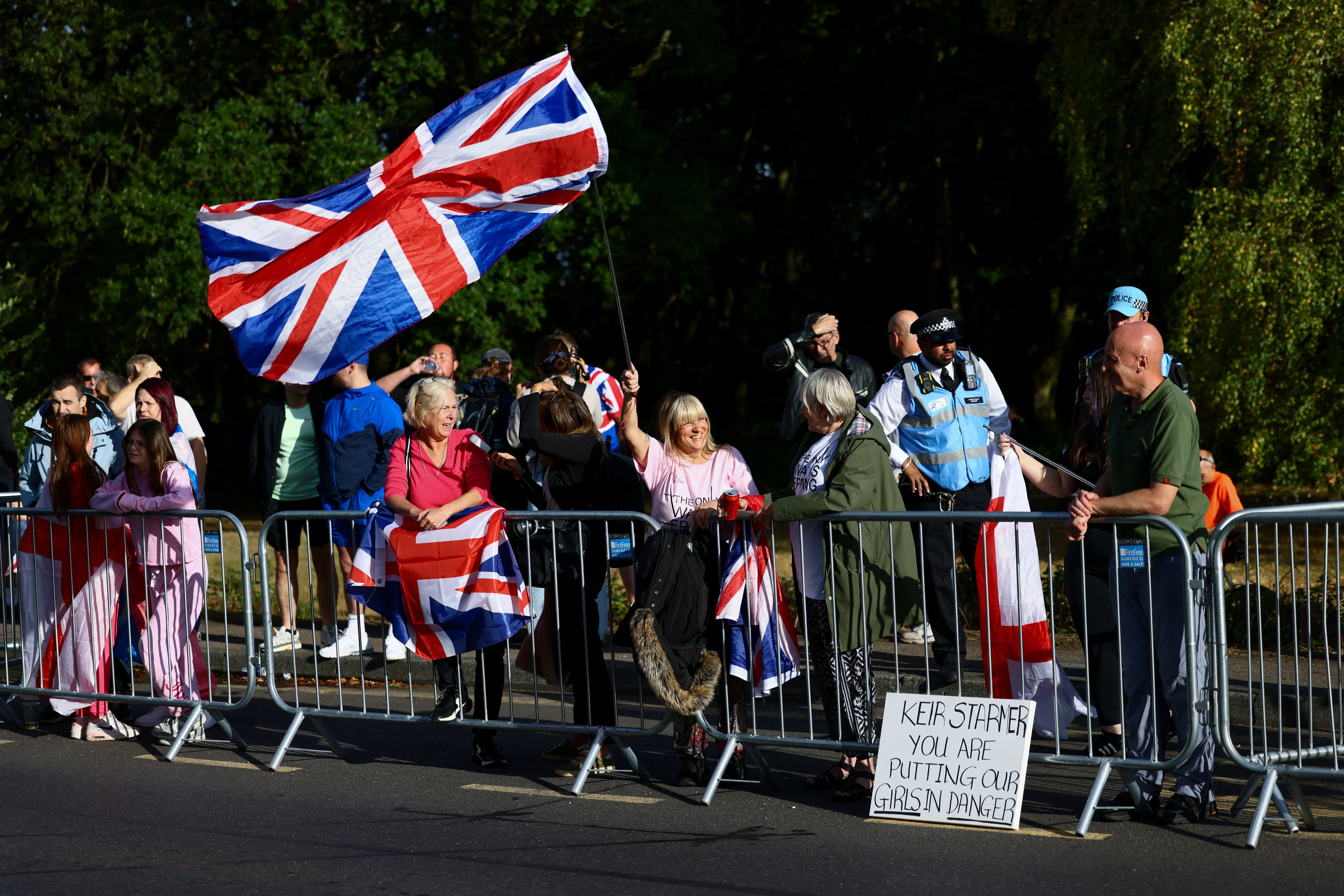 Protesters attend an anti-immigration demonstration outside The Bell Hotel, in Epping