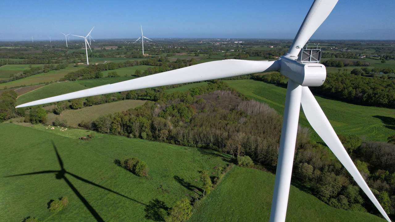 FILE PHOTO: A drone view of power-generating windmill turbines in La Regrippiere