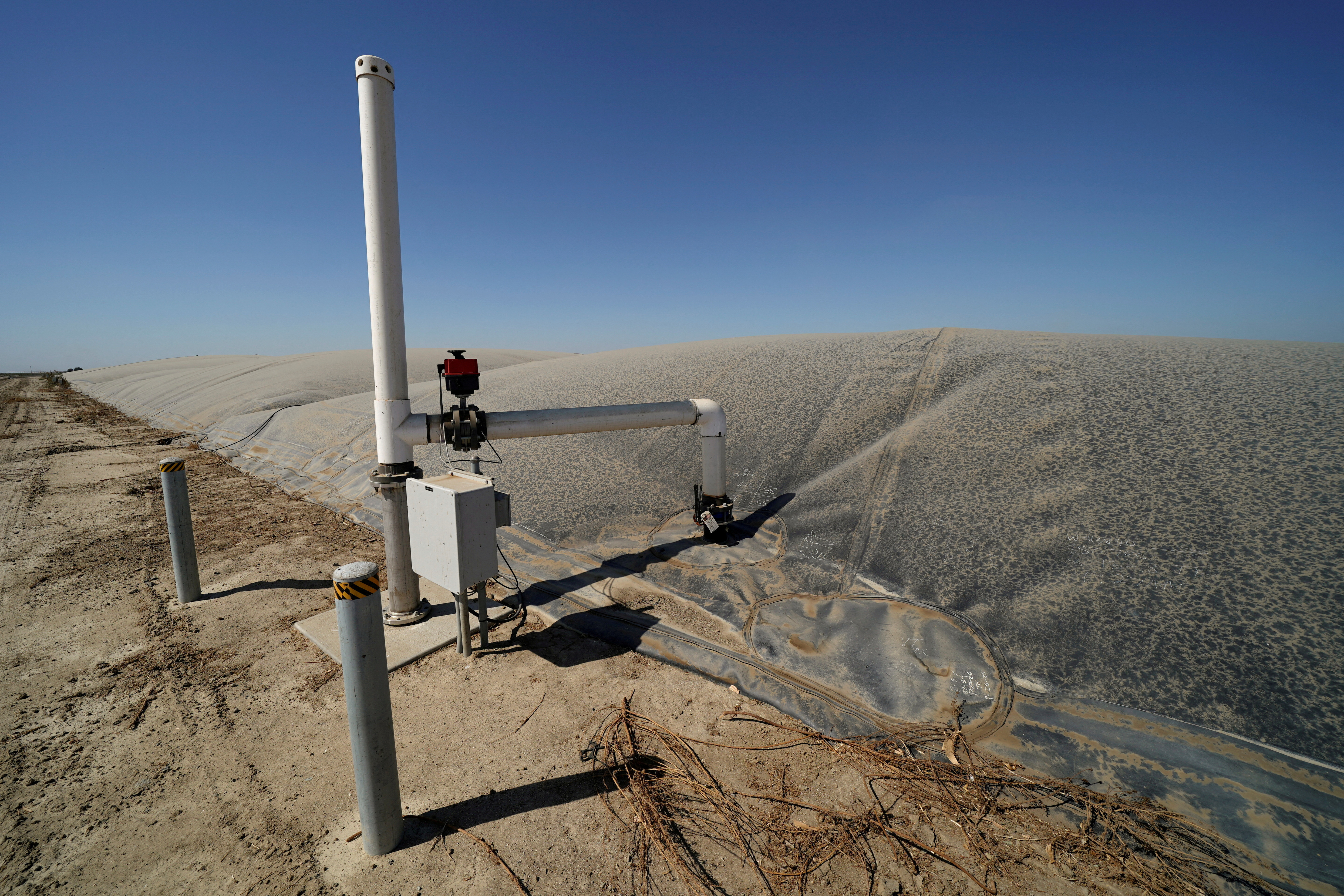 FILE PHOTO: A methane collecting dome that covers one of Airoso Circle A Dairy's waste collecting ponds is shown in Pixley, California