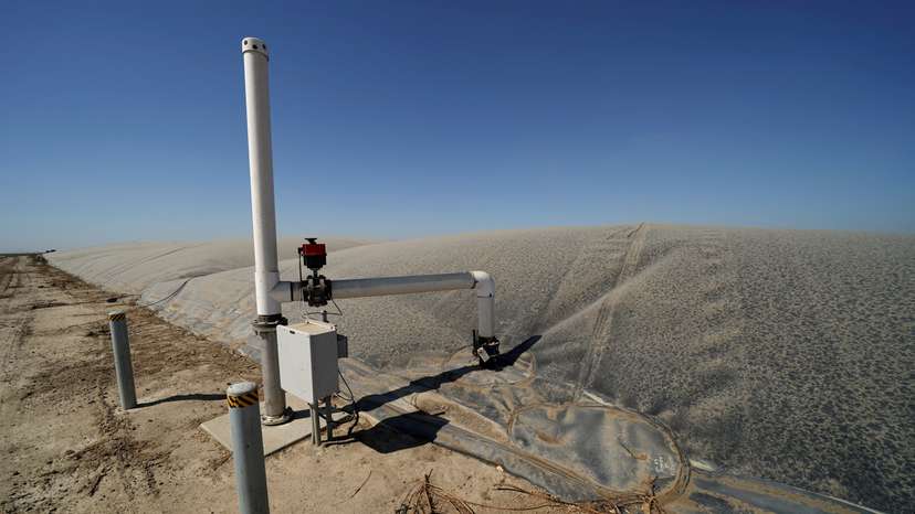 FILE PHOTO: A methane collecting dome that covers one of Airoso Circle A Dairy's waste collecting ponds is shown in Pixley, California