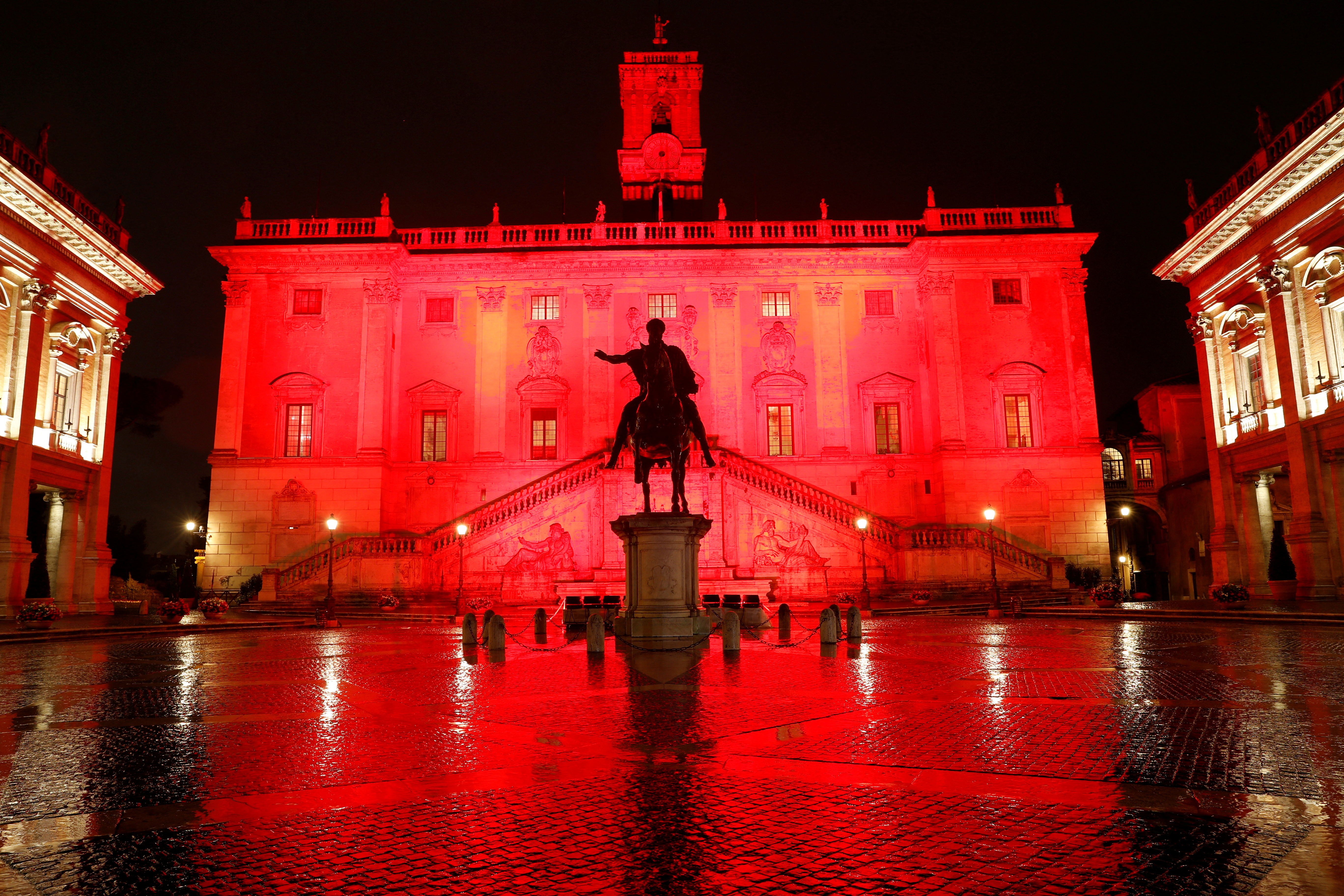 FILE PHOTO: The Campidoglio is lit up in red to mark International Day for the Elimination of Violence Against Women
