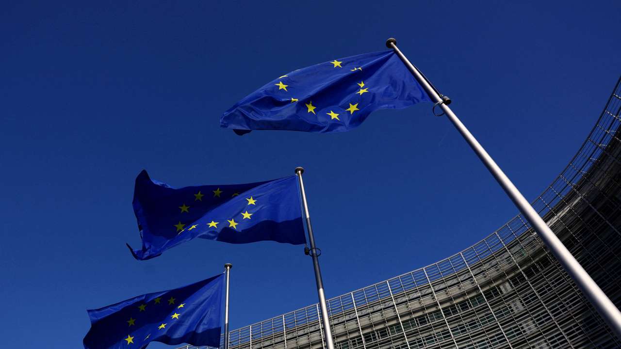 FILE PHOTO: European Union flags flutter outside the European Commission headquarters in Brussels