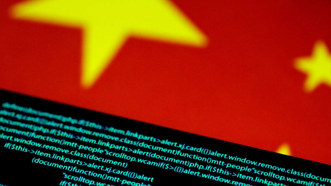 FILE PHOTO: Illustration photo of computer code on a screen above a Chinese flag