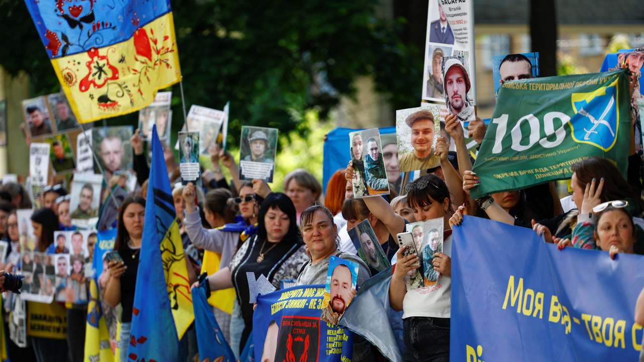 Relatives of Ukrainian prisoners of war wait for their arrival after a swap in an undisclosed location in Ukraine