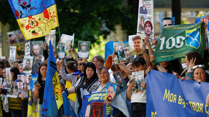 Relatives of Ukrainian prisoners of war wait for their arrival after a swap in an undisclosed location in Ukraine