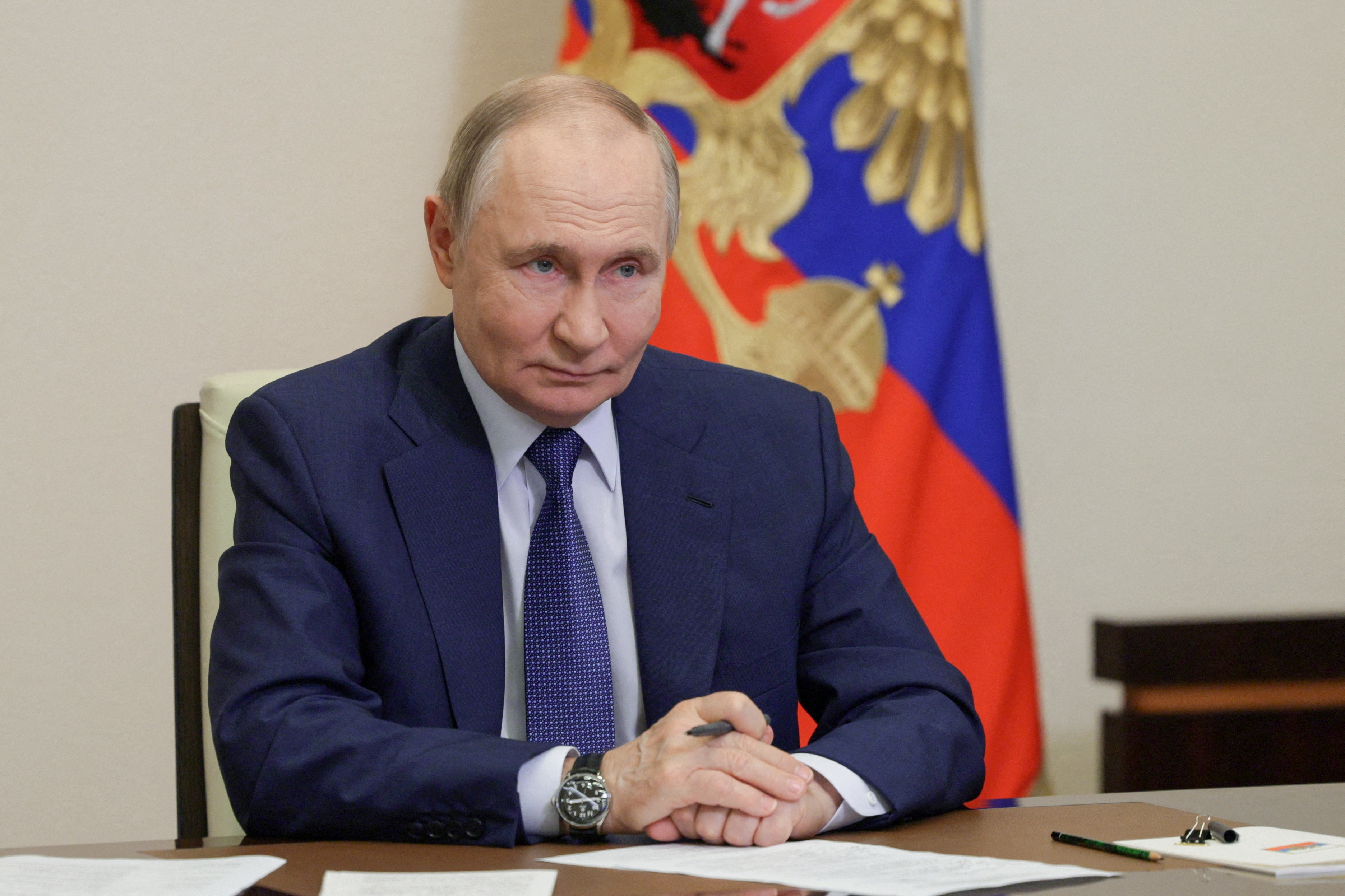 FILE PHOTO: Russian President Putin takes part in a ceremony outside Moscow