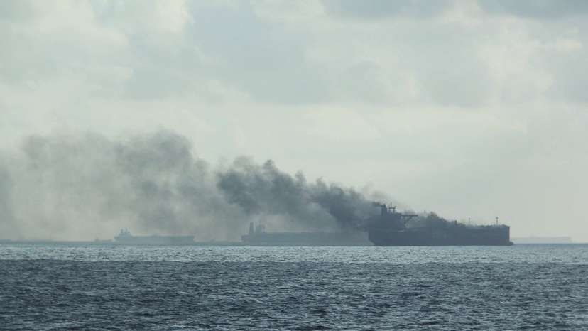 Rescue teams reach oil tankers on fire off the Singaporean island of Pedra Branca