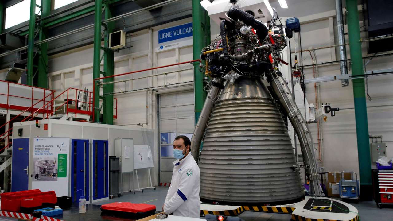 FILE PHOTO: A worker of Ariane Group stands in front of a Ariane 6 rocket's Vulcain 2.1 engine, prior to the visit of French President Emmanuel Macron, in Vernon
