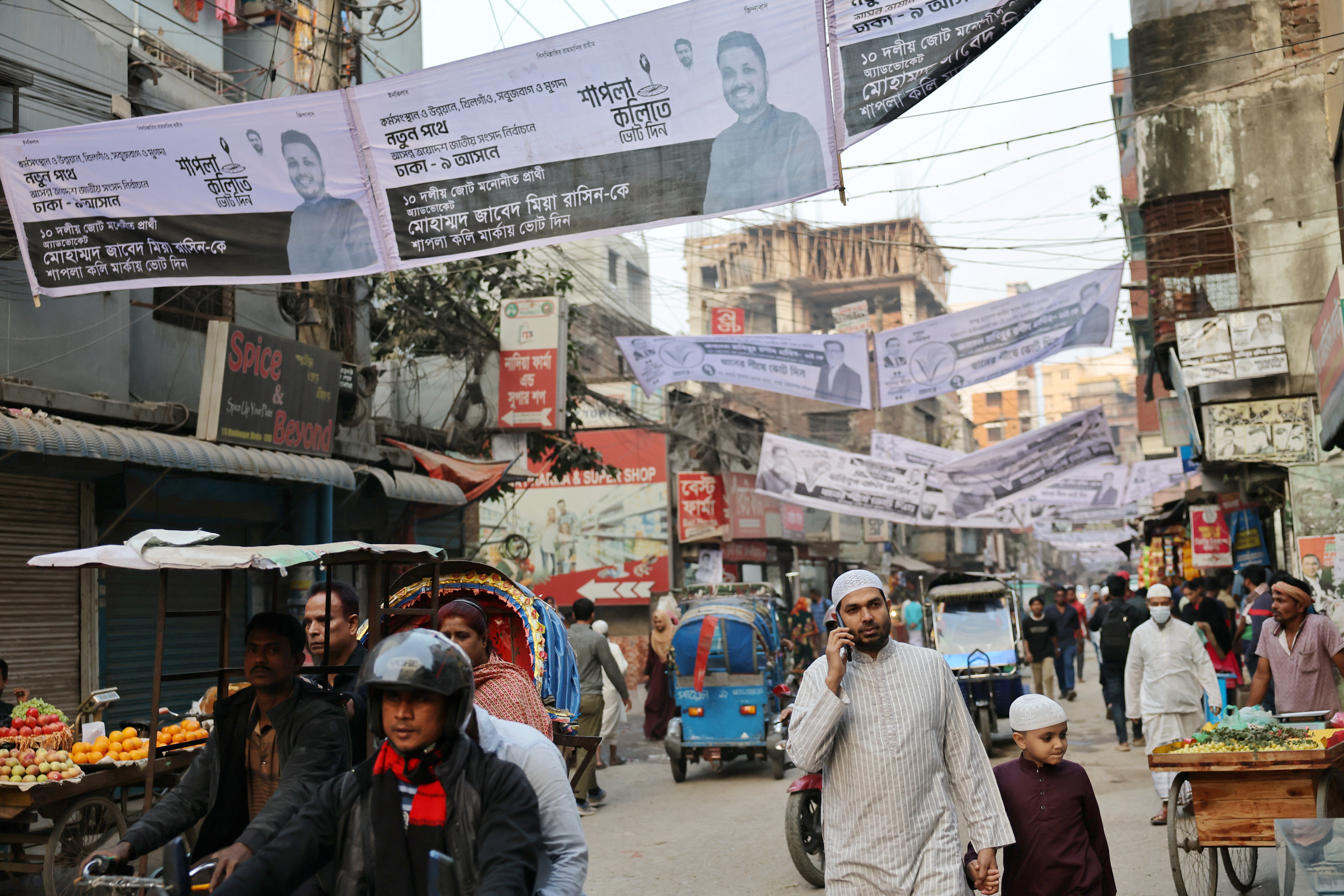 Election campaign banners of candidates hang over the streets ahead of the national election in Dhaka